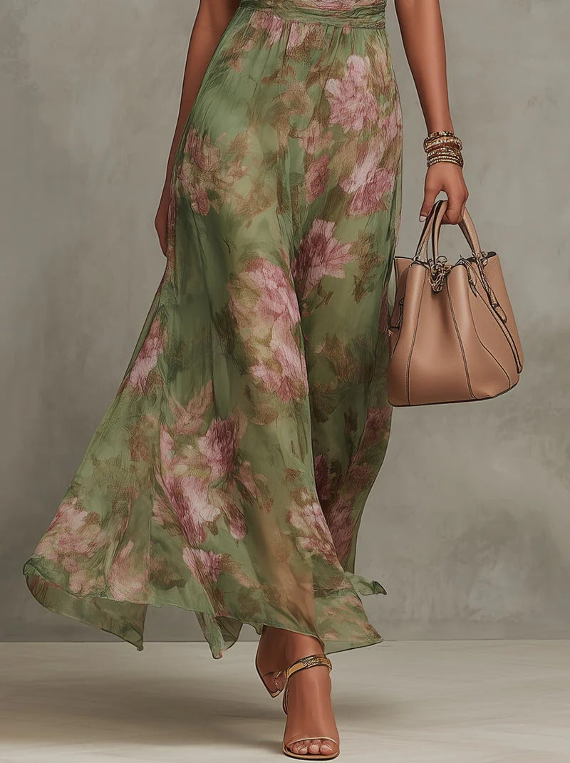Serena - Vestido largo de gasa verde con estampado floral y escote halter.