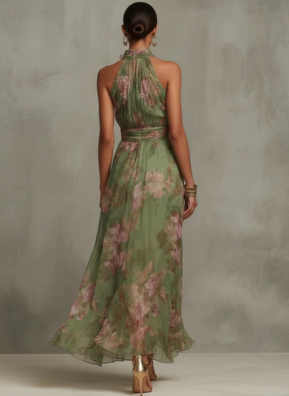 Serena - Vestido largo de gasa verde con estampado floral y escote halter.